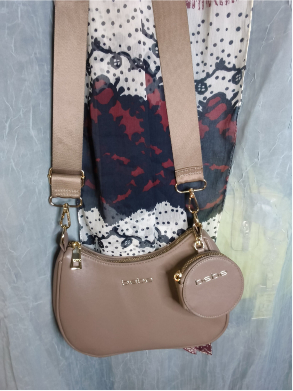 bebe Mara PU Crossbody in an almond/taupe color